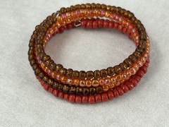 Multicolor Beaded Memory Coil Bracelet Orange Brown Red Iridescent