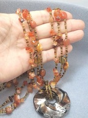 Multi-strand piece amber-toned Glass Gemstone Beads, large round pendant 26in.