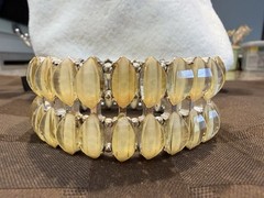 Vintage with an expandable Lucite bracelet in great condition. 1.5″ wide