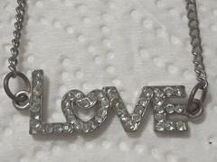 Lot of silver tone chain necklaces with rhinestone pendants. Coin, Love + Luck