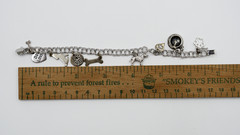 Vintage Sterling silver 925 dog bracelet with nine charms from 1995-1996