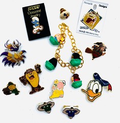 VTG LOT 12 CARTOON CHARACTER BRAND PINS – WARNER BROS, LOONEY TOONS, SMURF, AVON