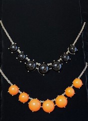 2 Statement Necklaces each 18″-20″ one Black and one Orange.