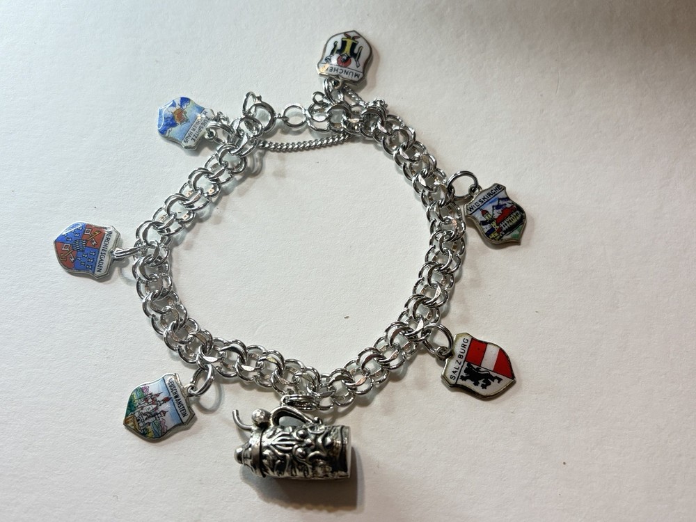Vintage travel bracelet Sterling with charms popular between 1950 and 1970,