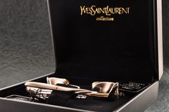 Near mint, gold and Cufflinks and silver tie clip, “Yves Saint Laurent”, case.