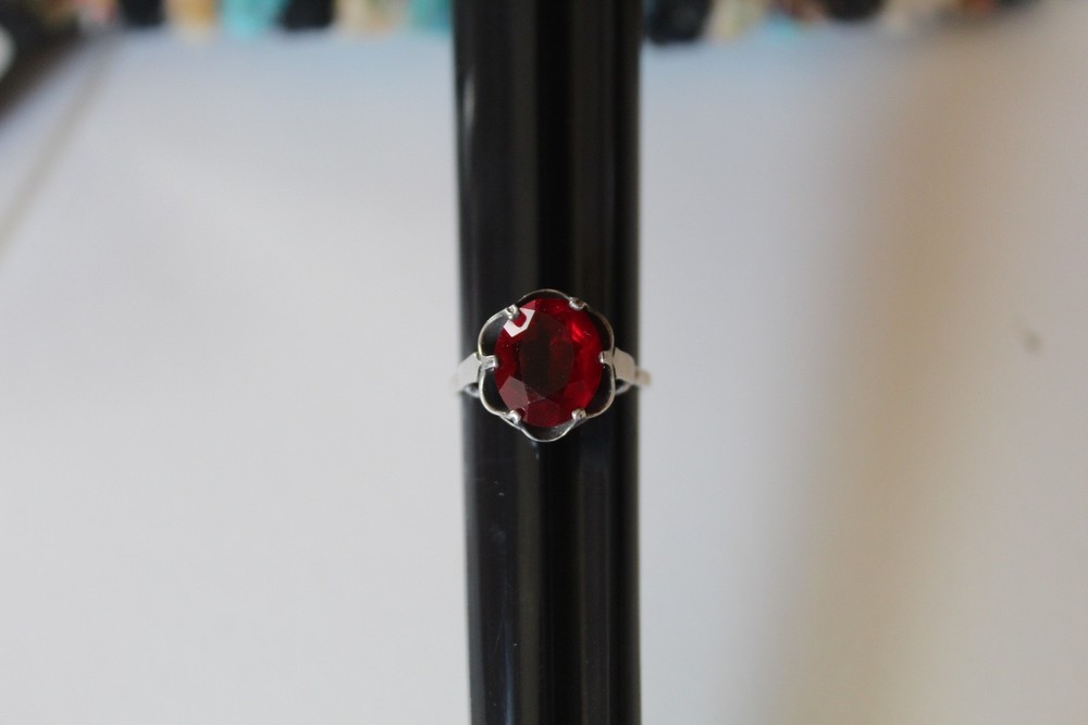 MARKED STERLING SARAH COV SIZE 8.5 RING WITH PRONG SET RED STONE