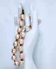 Miriam Haskell statement necklace featuring oversized faux baroque pearls.