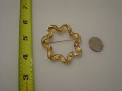 Sarah Coventry wreath pin 2.25″ diameter with white rhinestones