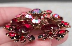 Vintage gold-toned Brooch featuring Ruby Red Navette and round Aurora Borealis