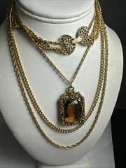 32 in.³ triple strand Goldette amber colored faceted glass necklace