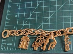 Vintage Jackie Collins Gold Tone Enamel Lady Boss Charm Bracelet Toggle Clasp