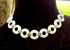 vintage Monet choker necklace featuring white enamel rings joined by gold tone