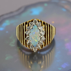Vintage circa 1970s 14k Yellow Gold Marquise Opal Ring with Diamond Halo