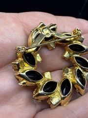 Opaque Black Rhinestone And Gold Toned Circle Wreath With Navette Vintage Brooch
