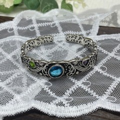 Openwork carved blue topaz bracelet for women, vintage style.