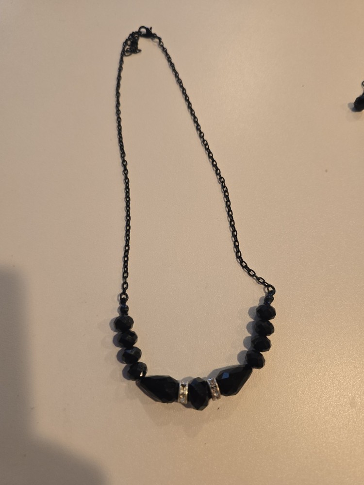 vintage-style beaded necklace black faceted beads and silver-toned spacers.