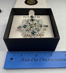 Napier silver-tone snowflake pin/brooch featuring blue and green rhinestones NOS