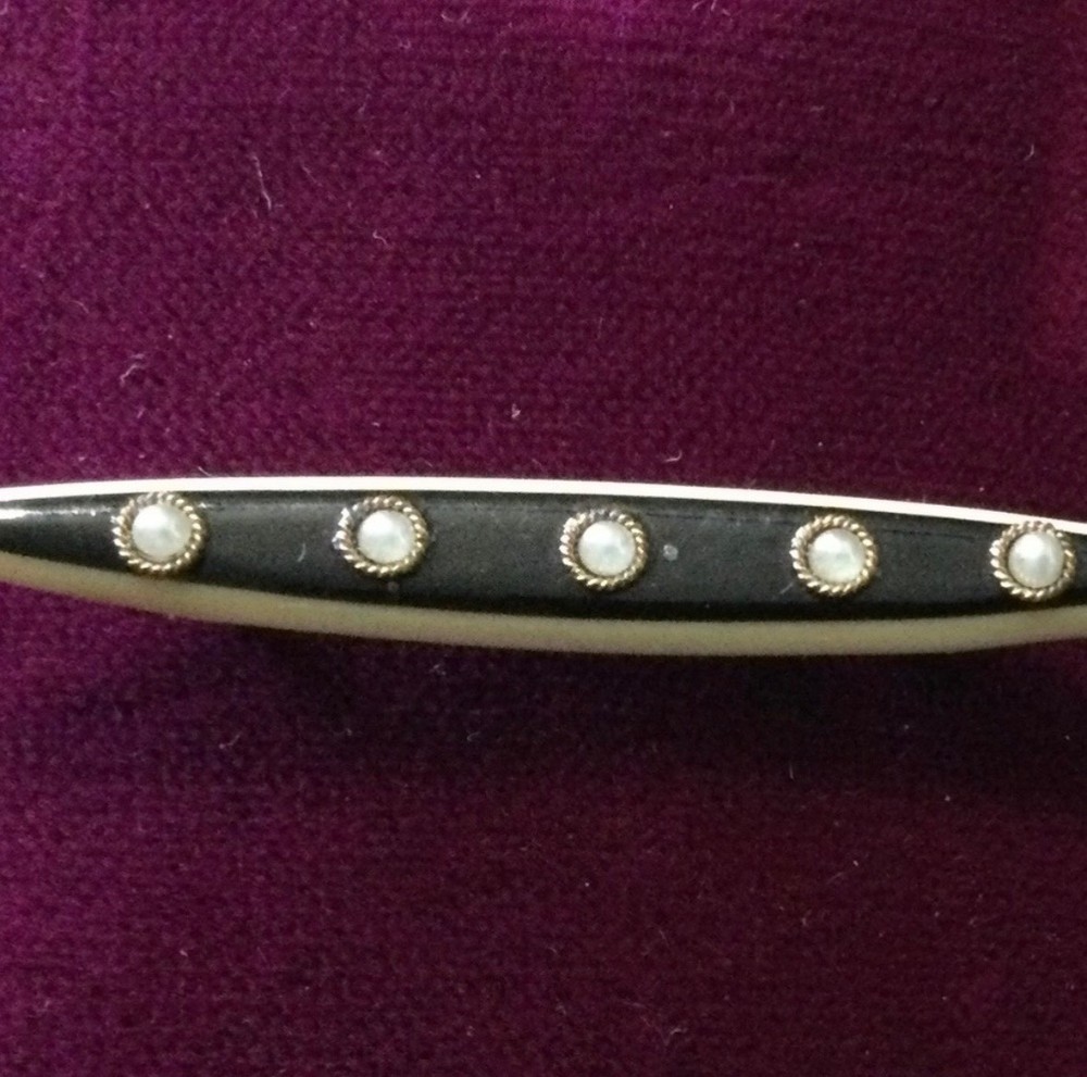 vintage celluloid bar pin with pearl look insets. Est. from the 1930-1940’s