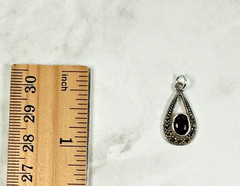 Sterling Silver Teardrop Pendant with Reddish Brown Faceted Oval Stone – 1″