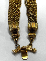 Vintage Ornate Gold-tone Coin attached to 24 dangling tassel Chains Bracelet