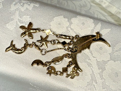 Gold Tone Crescent Moon With Dangling Stars, Cupid, Moon, Rhinestones Brooch