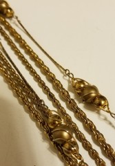 Vintage multi strand cage bead necklace in rich matte goldtone.