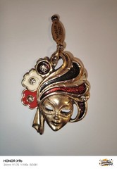 A Detailed Venetian Mask Charm in Gold-Tone Metal with Enamel and Crystal Detail