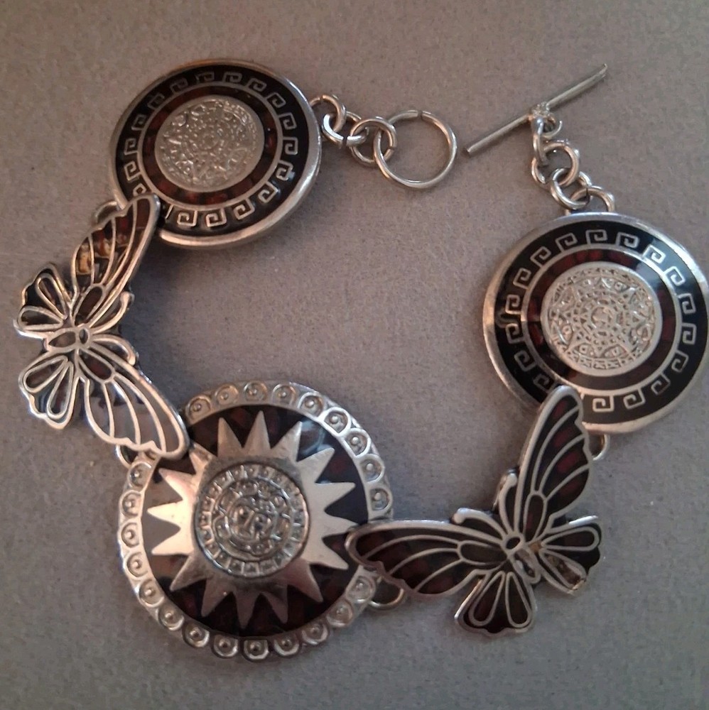 Mexican alpaca silvertone butterfly & Aztec sun medallion bracelet. 7″