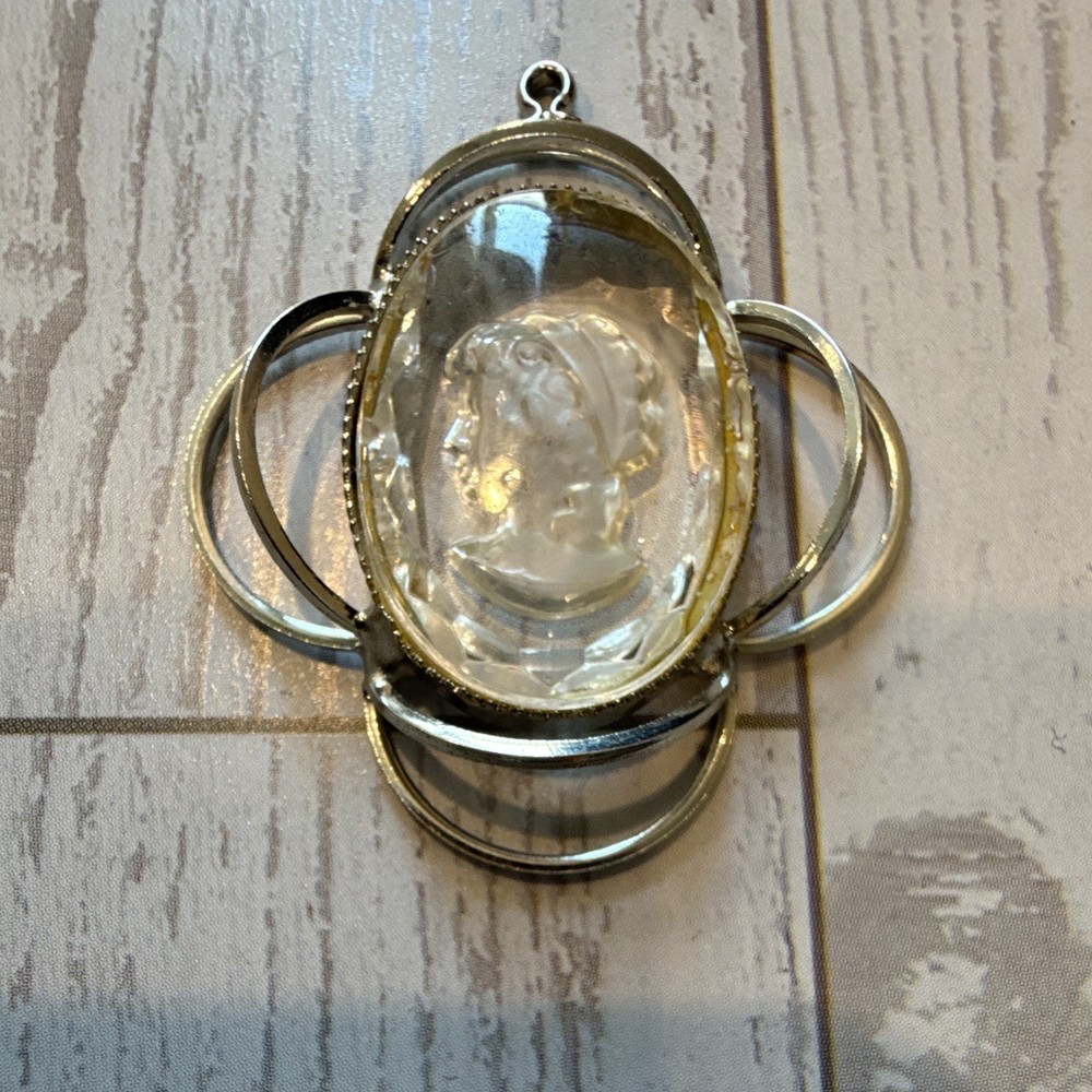 Vintage Silver Tone Oval Clear Cameo Pendant in Silver Setting.