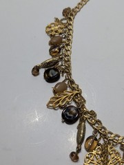 ✨VINTAGE✨ 16″ Ornate Gold Tone Dangling Necklace w/ Charms, Stones & Beads