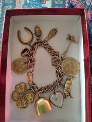 1950’s Charm Bracelet 11 Charm Heavy Gold Tone Good Condition