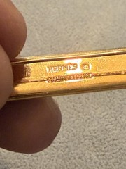 vintage Hermes enamel bar brooch featuring a vibrant red, blue, and gold JB1