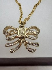 Authentic CELINE Paris Gold Tone Bow Crystal Pendant Necklace 26 in.