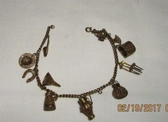 Adorable Gilded Silver Vintage Charm Bracelet. Approximately 8″ long.