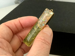Vintage gold plated genuine Opal Peridot nuggets in resin bar pendant 0.5” x 2”