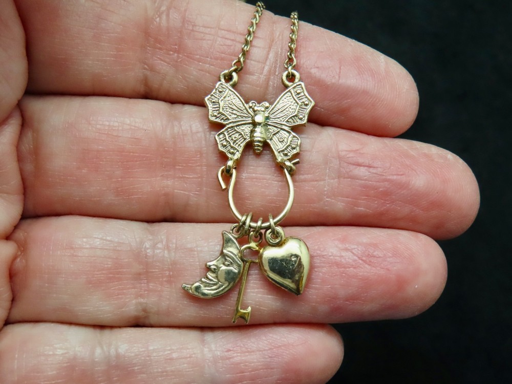 Vintage “1928 Jewelry” Gold Tone w/Butterfly Charm Holder w/Charms