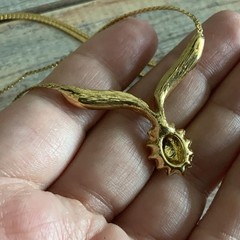 Vintage man made low grade opal and garnet v necklace in gold tone