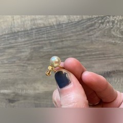 Vintage women’s stamped metal, gold color, and faux pearl earrings
