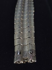 Les Bernard Inc Bracelet Wide Articulated Link Bracelet Textured Wave Pattern