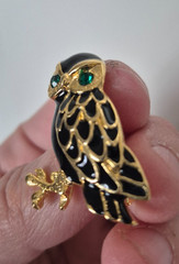 Cute, vintage owl brooch with black enamel and green rhinestone eyes