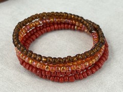 Multicolor Beaded Memory Coil Bracelet Orange Brown Red Iridescent
