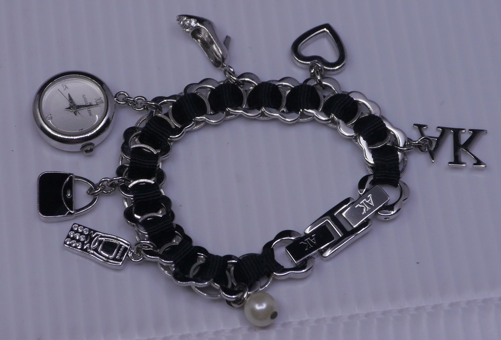 L – OLDER ANNE KLEIN SILVER TONED CHARM BRACELET WITH WATCH, 7 INCHES