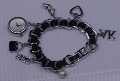 L – OLDER ANNE KLEIN SILVER TONED CHARM BRACELET WITH WATCH, 7 INCHES