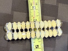 Vintage with an expandable Lucite bracelet in great condition. 1.5″ wide