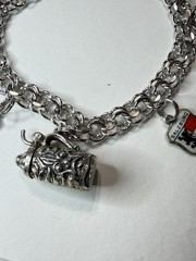 Vintage travel bracelet Sterling with charms popular between 1950 and 1970,