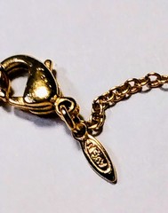 Unique Vintage 18 1/2″ Avon necklace with 2″ dangling ring with varies sized…