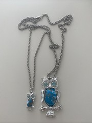 Vintage-style silver-tone owl pendant featuring a faux turquoise