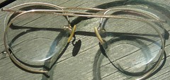 Gold “Granny” bifocal glasses, in attic
