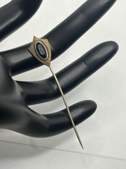 Antique Victorian gold tone stick pin purple glass faceted stone scroll design
