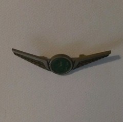 Stoffel Seals Signed Wing Brooch Pin Gold Tone Green Round Bezel Center
